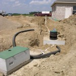 Dosing Tank (in Foreground) and Septic Tank. Both with Risers.
