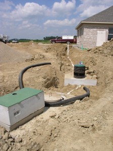 Dosing Tank (in Foreground) and Septic Tank. Both with Risers.